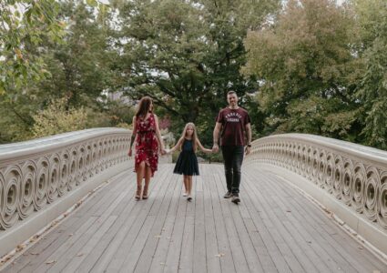 family photos in the bow bridge in central park, nyc