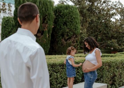 family and pregnancy photoshoot at the gardens of the royal palace of madrid, spain