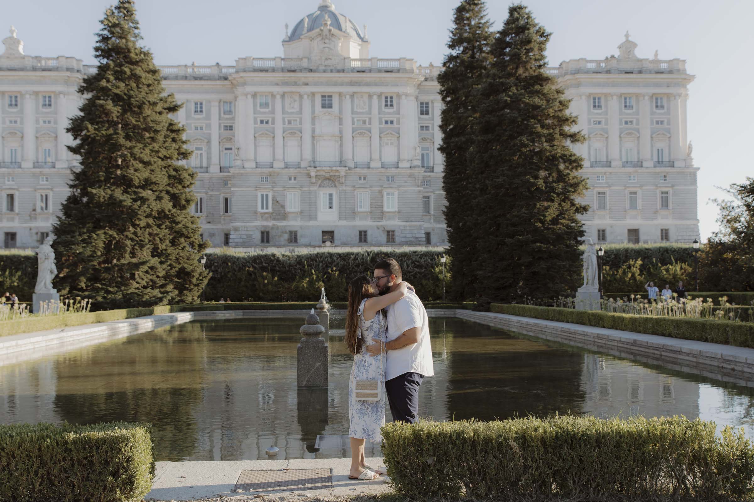 Couple hugging after engagement in Madrid