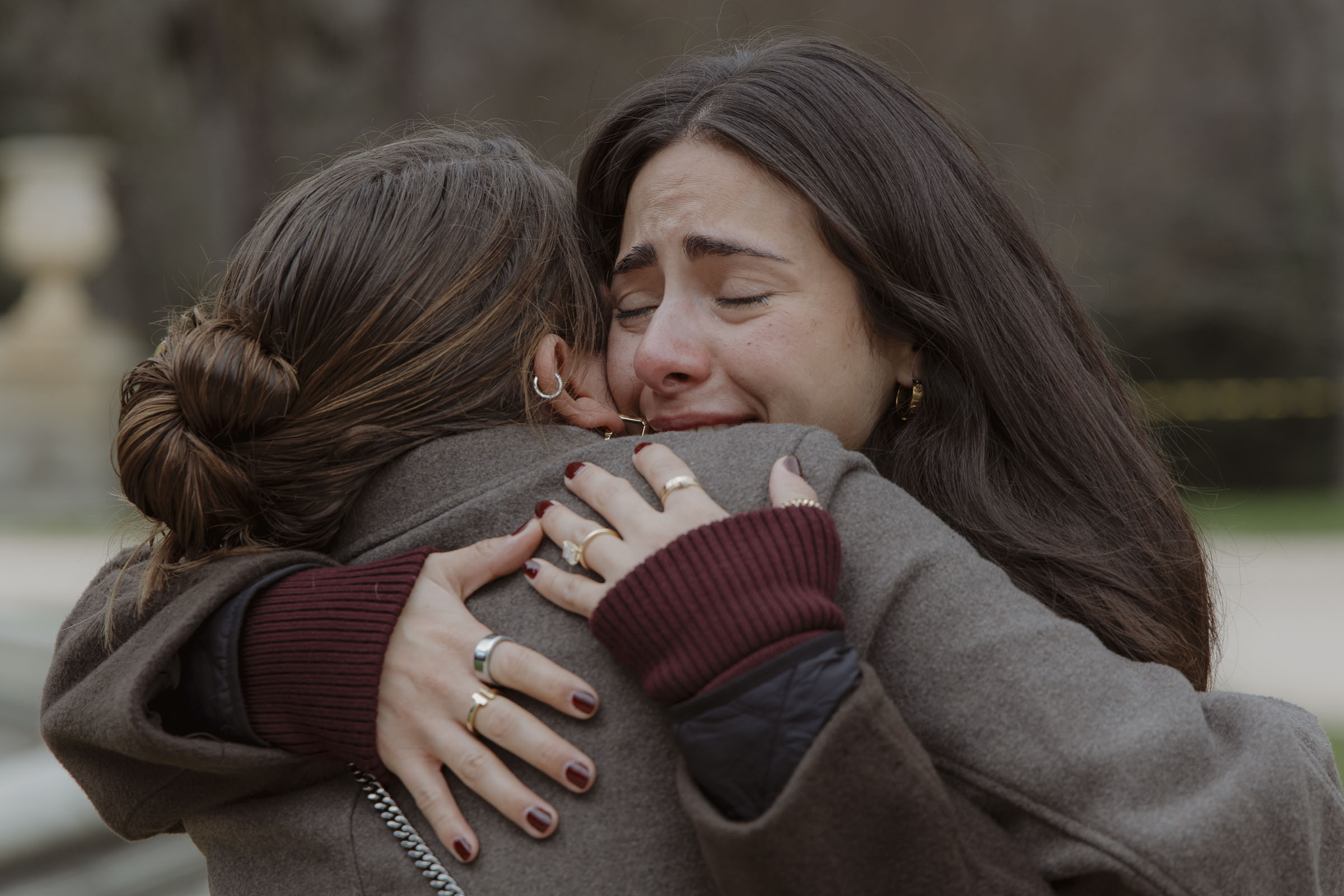 Friends celebrating after a surprise proposal in Madrid