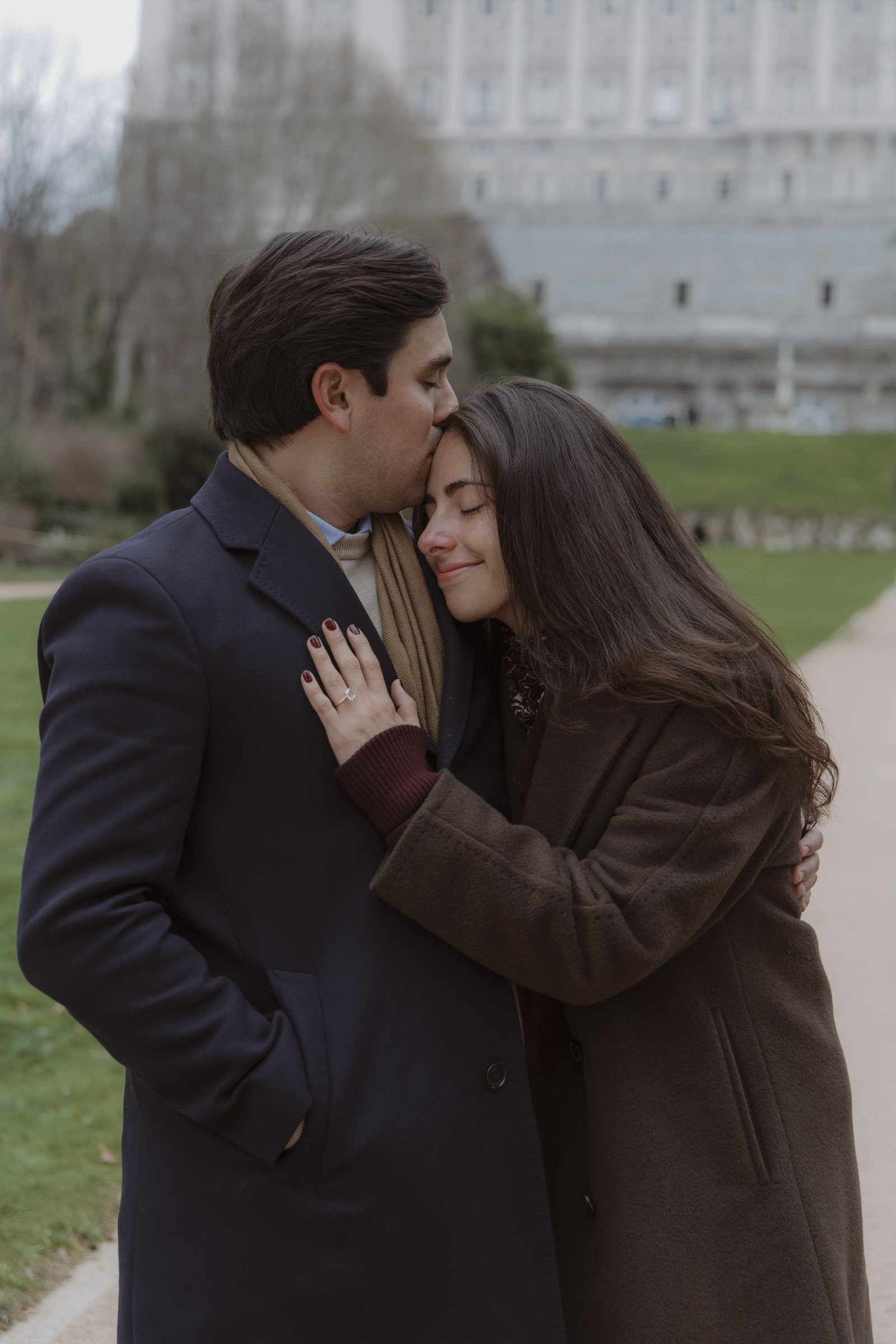 Joyful reaction after engagement in Madrid gardens