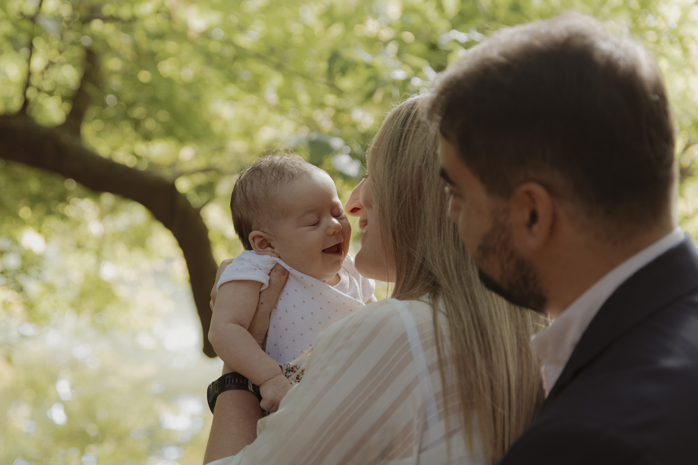 family photoshoot with a beautiful baby in retiro park in madrid