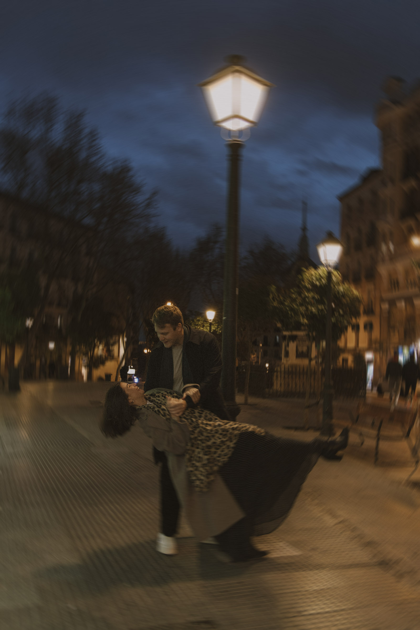 Couple walking through the streets of Madrid with a vintage film photography style