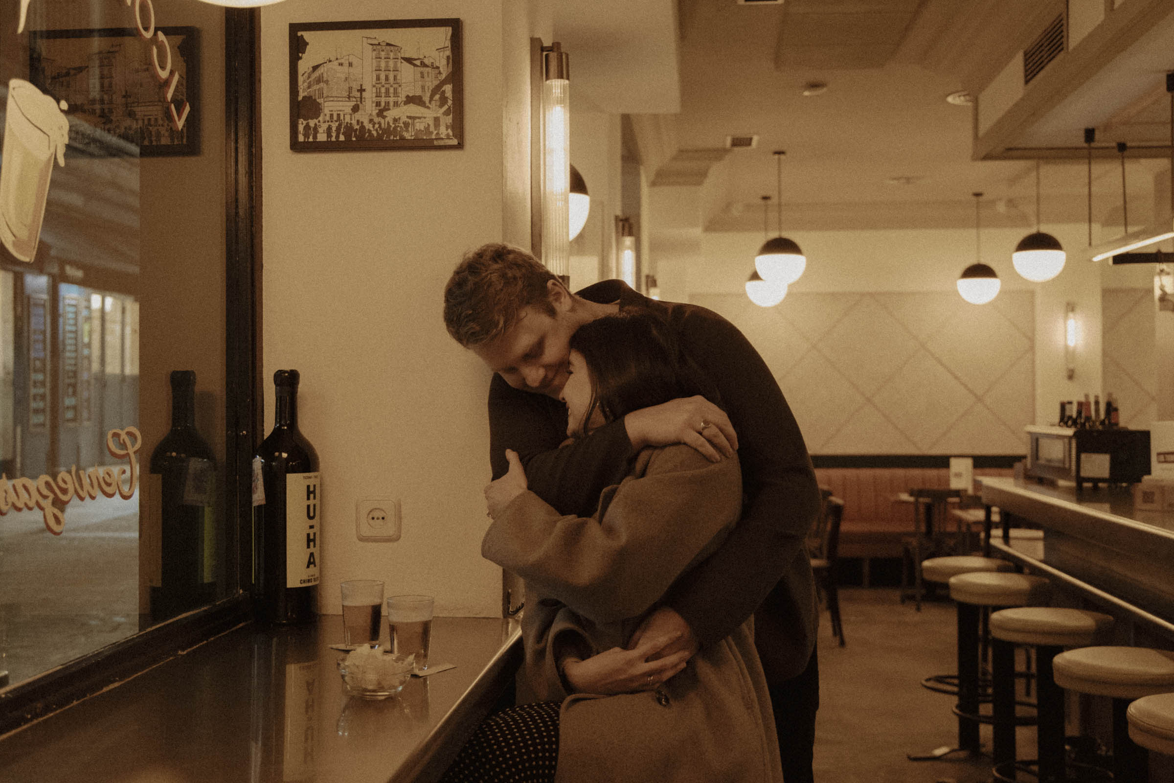 Couple kissing in the streets of Madrid during engagement session