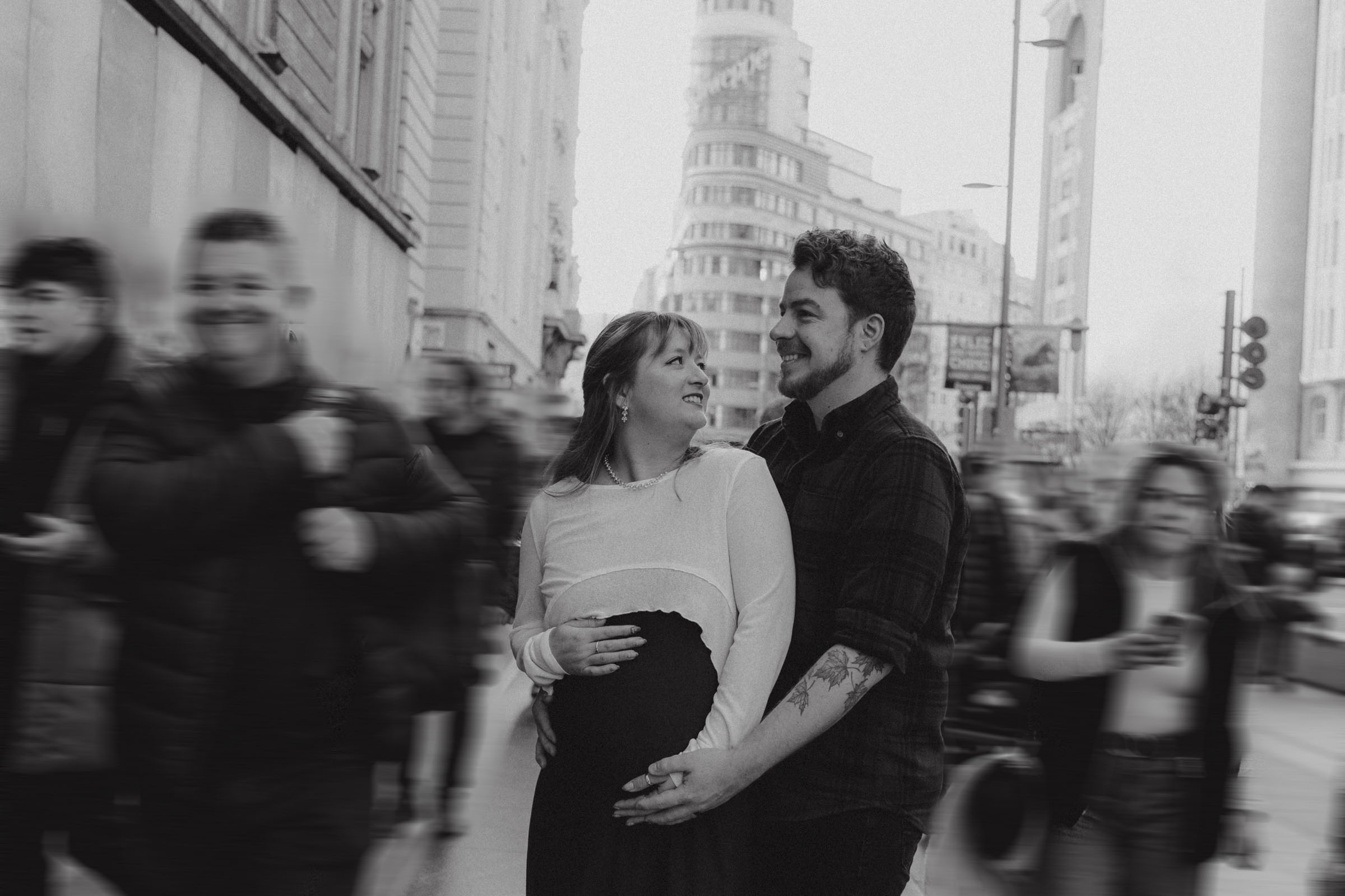 couple photoshoot in the middle of gran via street in the morning in madrid