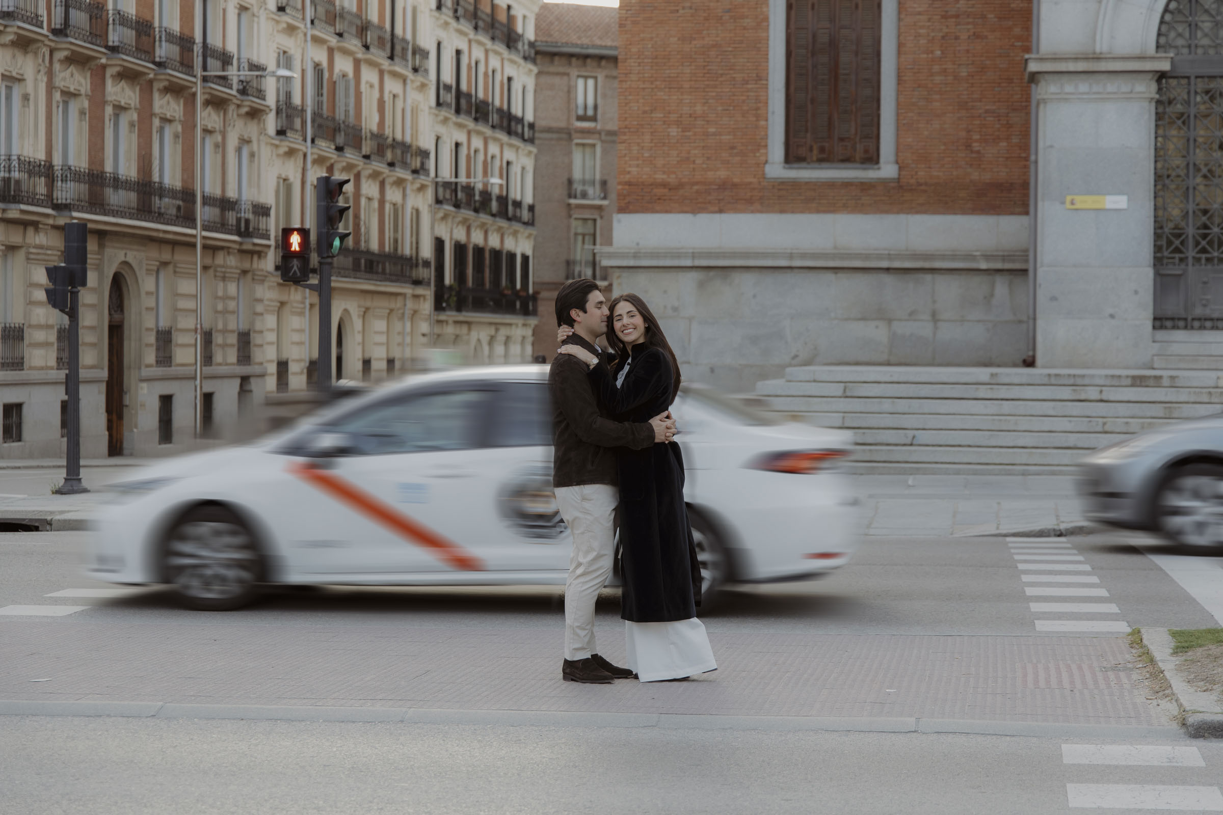 mexican couple doing their engagement photoshoot in the center of madrid