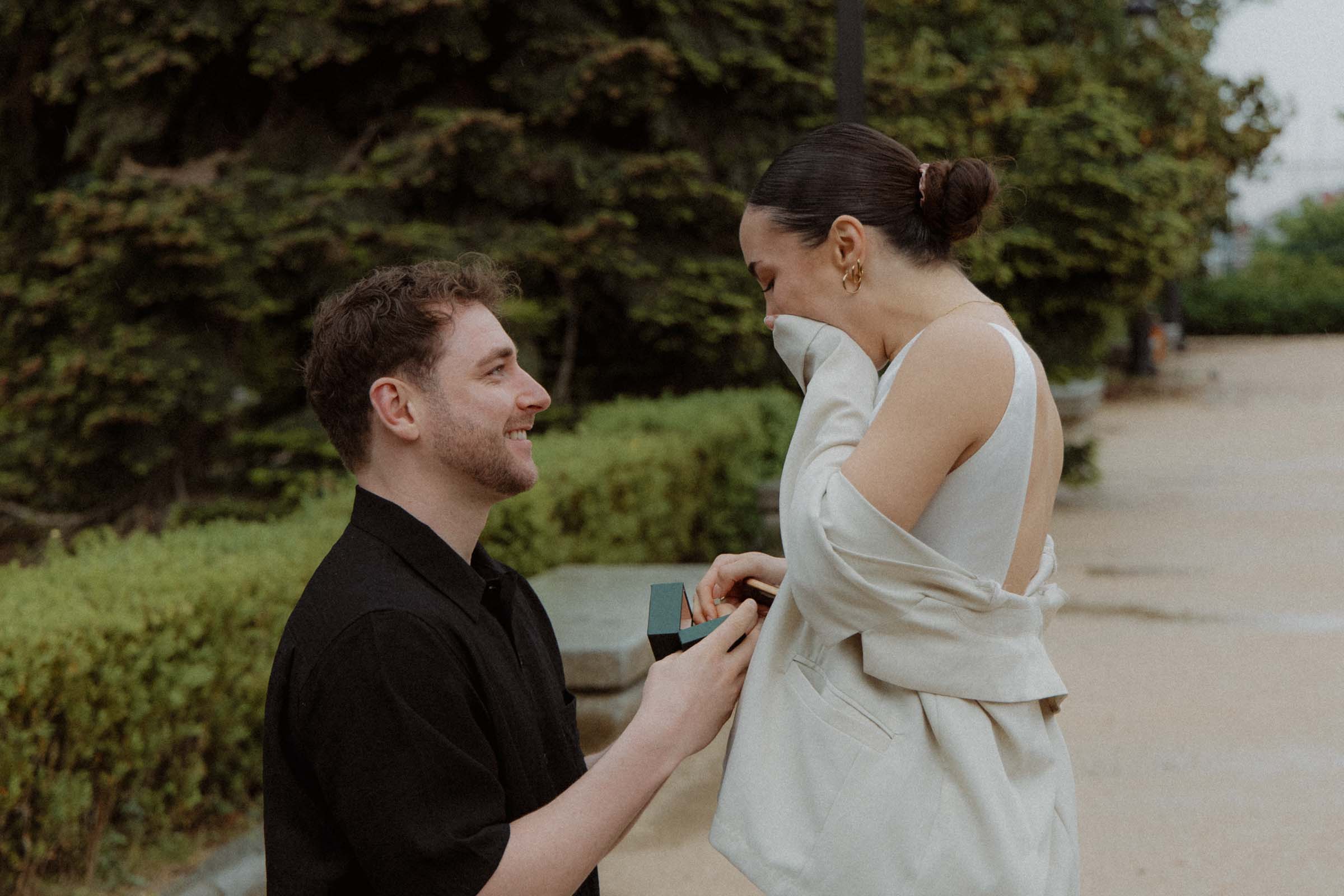 Emotional surprise proposal in Madrid with romantic atmosphere
