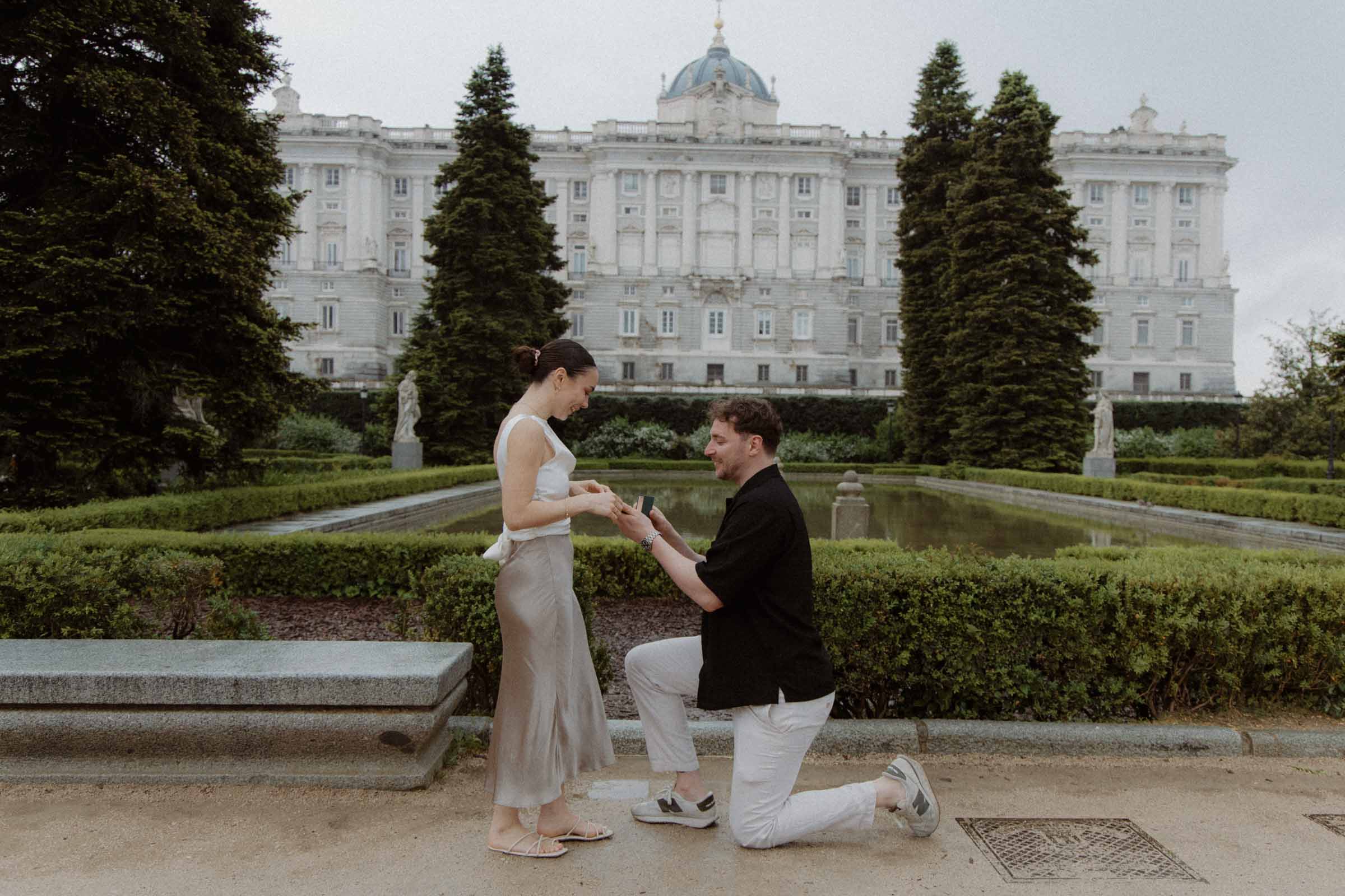 Romantic engagement photos in Madrid with the royal palace in the background